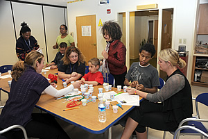 NHGRI staff and Children's Inn guests complete their DNA bracelets.