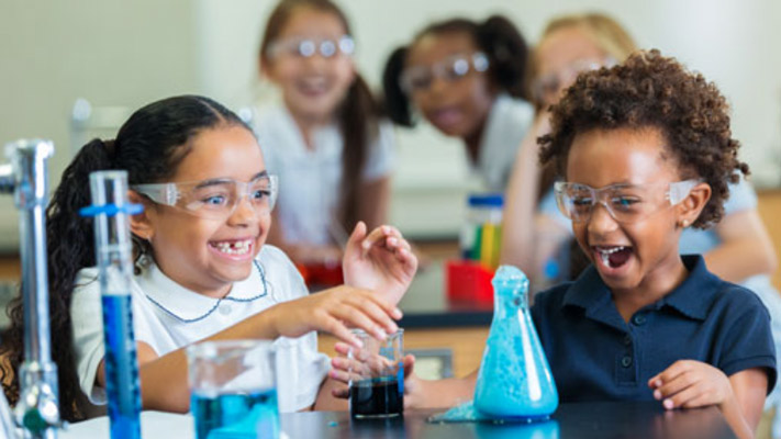 Student performing chemistry experiments in the classroom