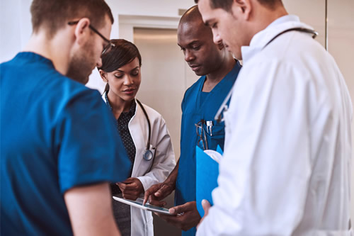 Healthcare providers gathered in a group]