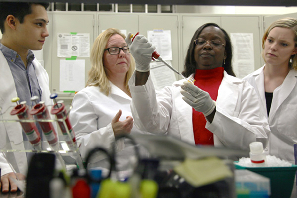 Scientist pipetting