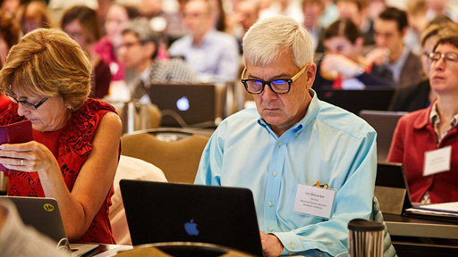 Man and woman on computer during meeting