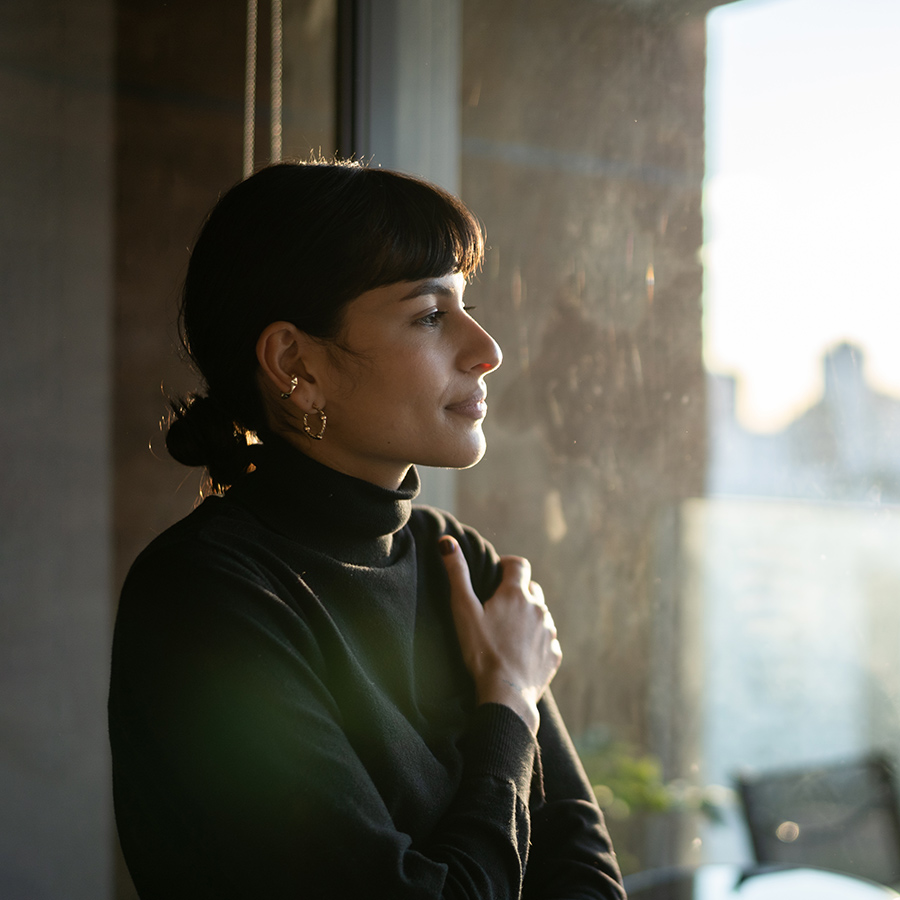 Woman looking out a window