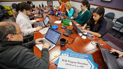 researchers sit at the table as they answer Reddit questions